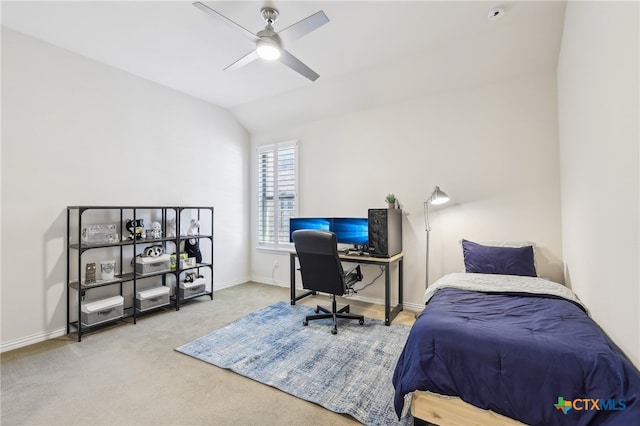 carpeted bedroom with ceiling fan, baseboards, and lofted ceiling