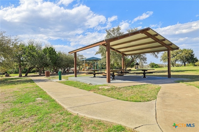 view of home's community with a yard