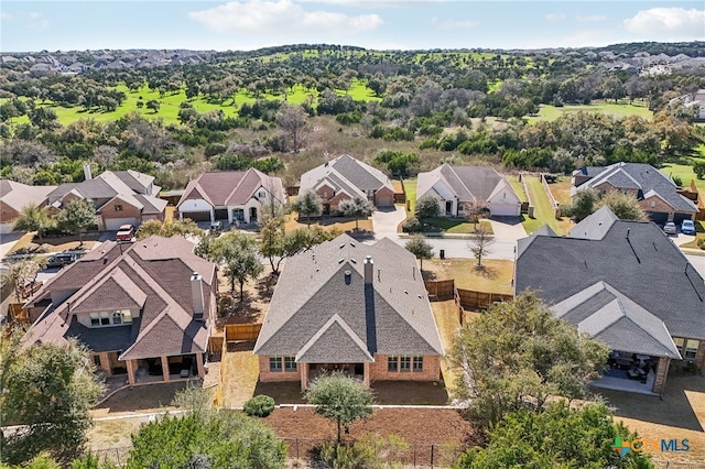 birds eye view of property with a residential view