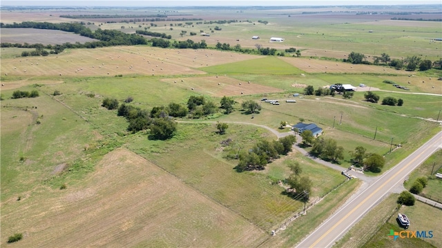 birds eye view of property featuring a rural view