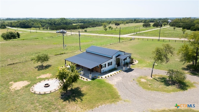 birds eye view of property featuring a rural view