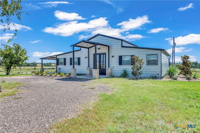 view of front of property with a front lawn