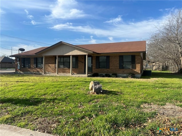 single story home with brick siding and a front lawn