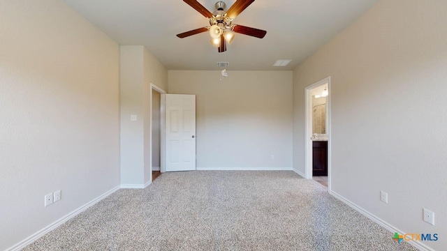 carpeted spare room featuring ceiling fan