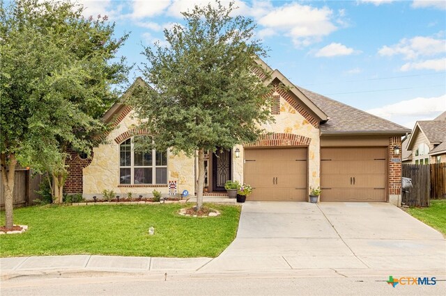 2194 Pioneer Pass, Seguin, TX 78155 - view of front facade with stone siding, a garage, and driveway