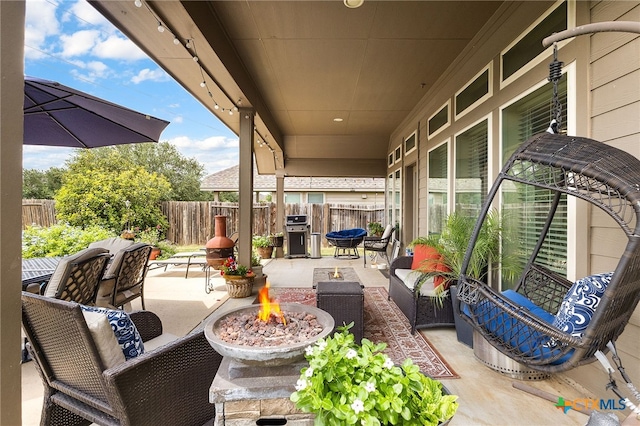 2194 Pioneer Pass, Seguin, TX 78155 - fenced backyard featuring a patio area, an outdoor living space with a fire pit, and area for grilling