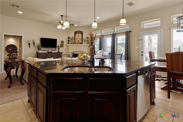 2194 Pioneer Pass, Seguin, TX 78155 - kitchen with dishwasher, ceiling fan, a fireplace, light tile patterned floors, and recessed lighting