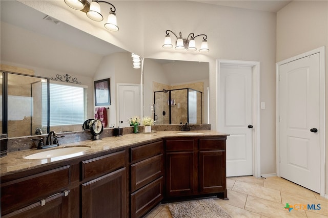 2194 Pioneer Pass, Seguin, TX 78155 - full bath with a shower stall, lofted ceiling, double vanity, and tile patterned floors