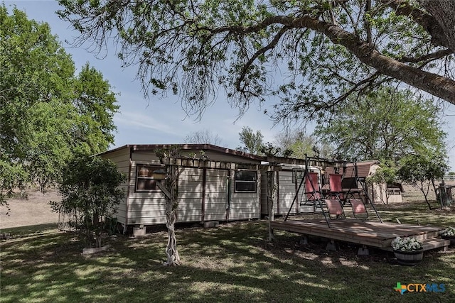 exterior space with a yard and a deck