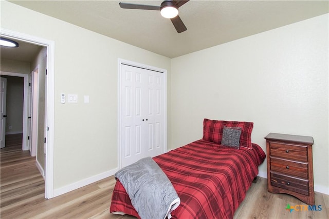 3918 Trinity Dr, Temple, TX 76504 - bedroom with wood finished floors, baseboards, a closet, and ceiling fan