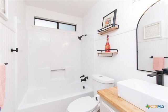 3918 Trinity Dr, Temple, TX 76504 - bathroom with toilet,  shower combination, vanity, and wainscoting