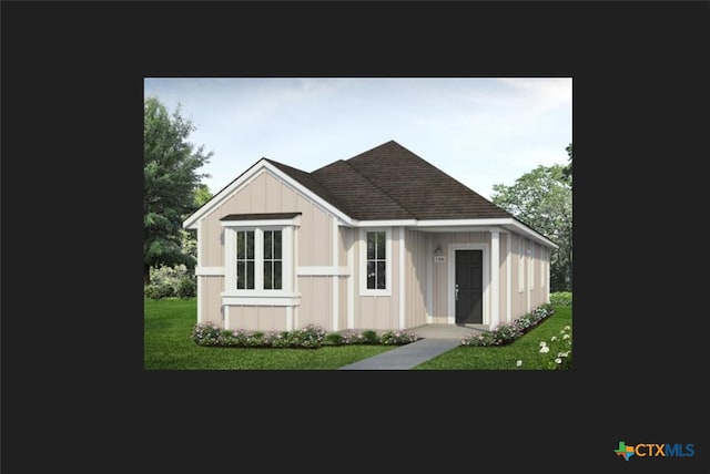 3027 Winding Creek Rd, Kyle, TX 78640 - view of front facade with a front yard, roof with shingles, and board and batten siding