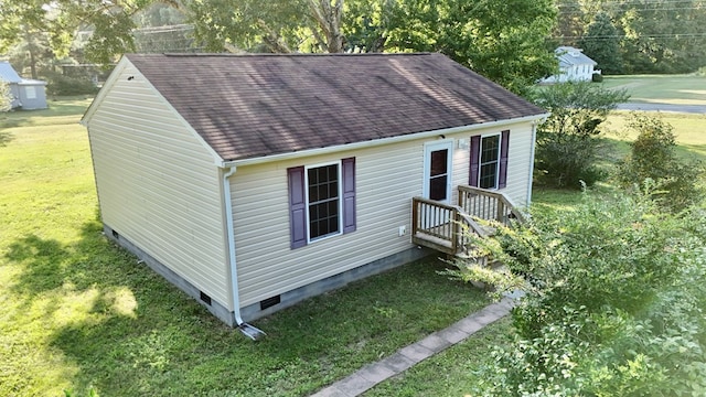 view of outbuilding featuring a lawn