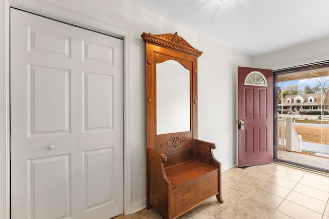 entryway with light tile patterned floors