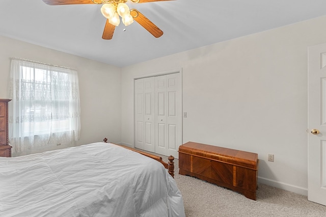 bedroom featuring light carpet, a closet, and ceiling fan