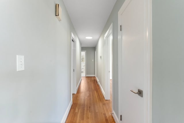 hall with light hardwood / wood-style floors