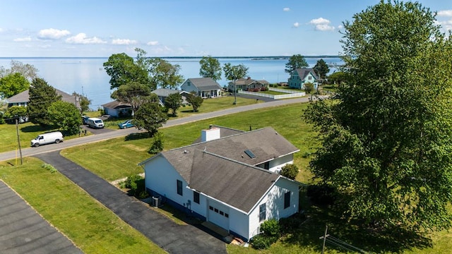 drone / aerial view with a water view