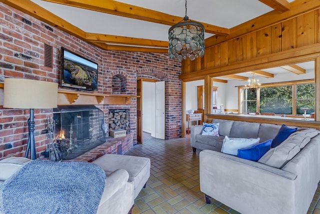 living room featuring beam ceiling, a notable chandelier, and wood walls