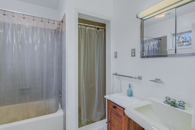 bathroom featuring vanity and shower / tub combo with curtain