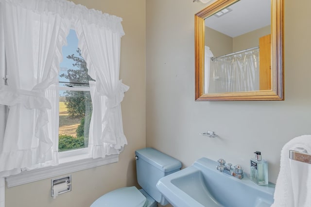 bathroom with toilet and sink