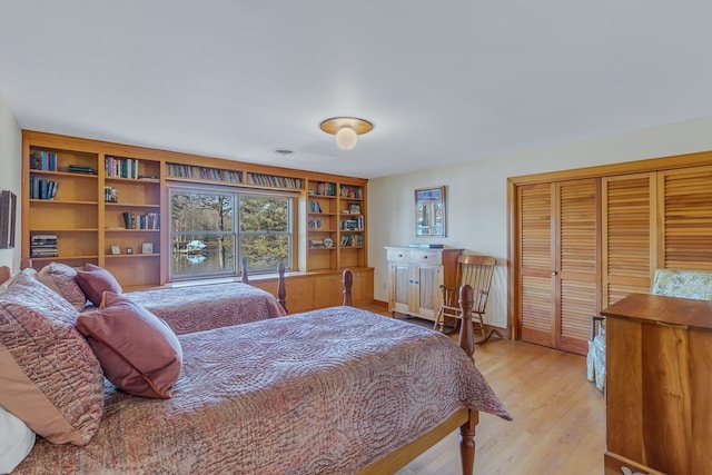 bedroom featuring light wood-type flooring