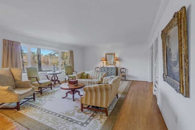 living room featuring crown molding and light wood-type flooring