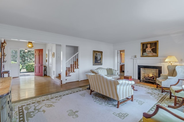 living room featuring crown molding and hardwood / wood-style floors