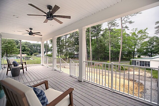 250 Pocahontas Ave, Deltaville, VA 23043 - wooden deck featuring ceiling fan and view of scattered trees