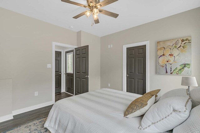250 Pocahontas Ave, Deltaville, VA 23043 - bedroom featuring dark wood-style flooring, baseboards, and a ceiling fan