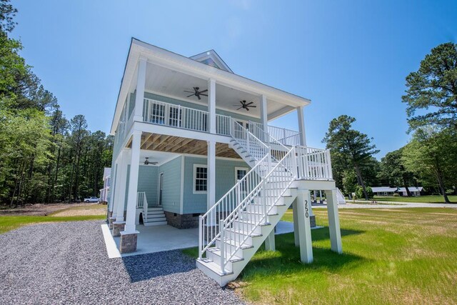 250 Pocahontas Ave, Deltaville, VA 23043 - view of front of house with ceiling fan, a front lawn, stairs, and crawl space