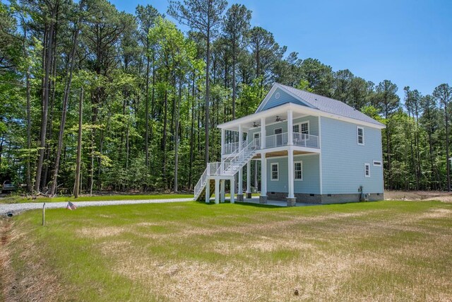 250 Pocahontas Ave, Deltaville, VA 23043 - back of property featuring crawl space, ceiling fan, a lawn, and a balcony