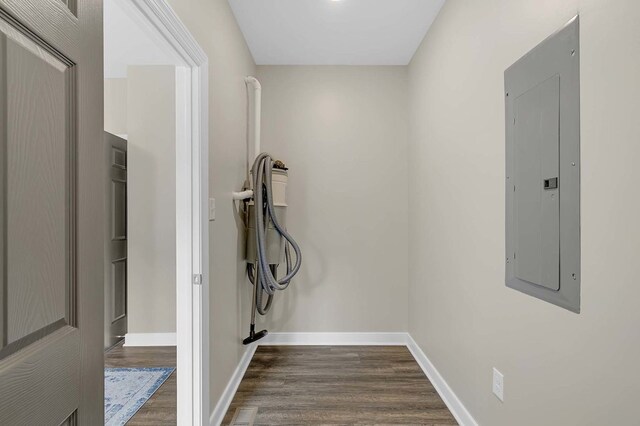 250 Pocahontas Ave, Deltaville, VA 23043 - washroom with electric panel, dark wood-style flooring, and baseboards