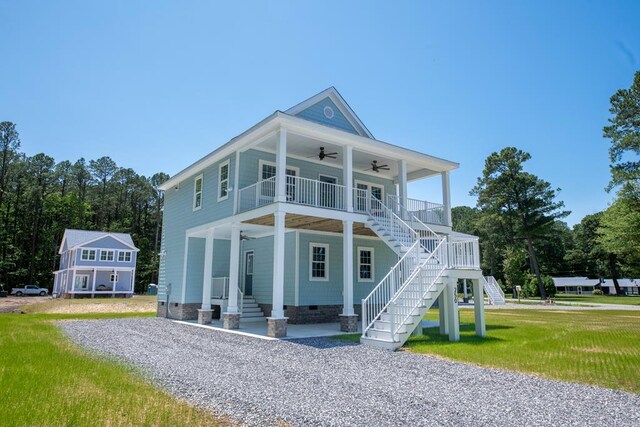 250 Pocahontas Ave, Deltaville, VA 23043 - view of front of home with ceiling fan, stairway, covered porch, crawl space, and a front lawn