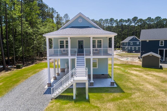 250 Pocahontas Ave, Deltaville, VA 23043 - view of front of property featuring stairway, a front lawn, covered porch, roof with shingles, and a patio area