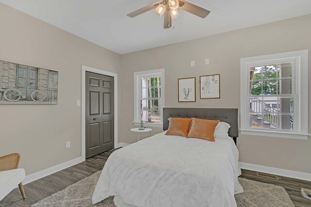 250 Pocahontas Ave, Deltaville, VA 23043 - bedroom with wood finished floors, baseboards, and ceiling fan