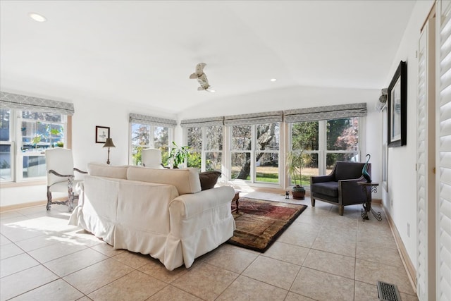 living room featuring light tile patterned floors, baseboards, visible vents, lofted ceiling, and recessed lighting