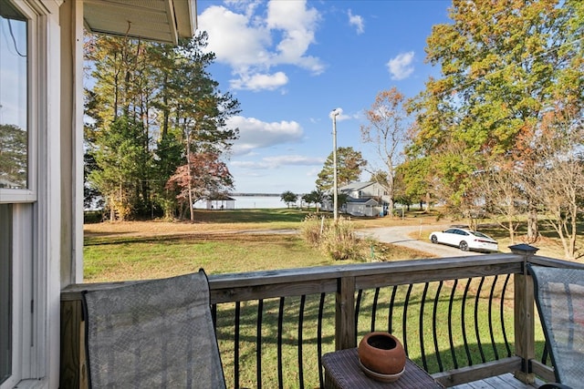 balcony featuring a water view