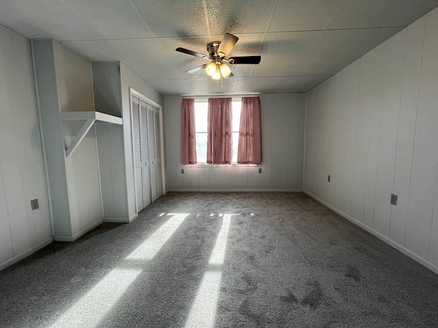 unfurnished bedroom featuring ceiling fan and carpet floors