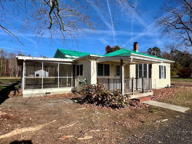 back of property featuring a sunroom