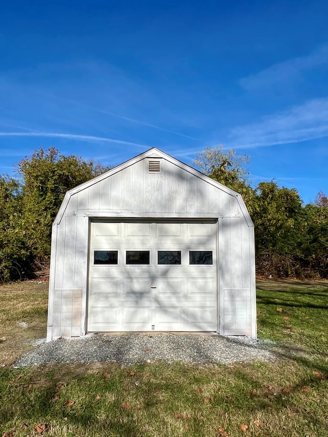 garage with a lawn