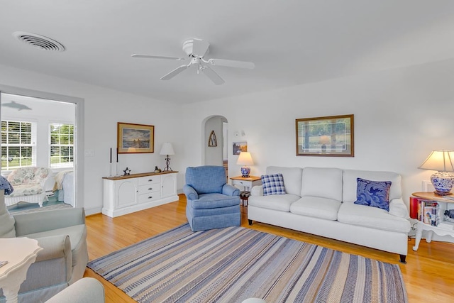 131 Henry Creek Ln, Kilmarnock, VA 22482 - living area with light wood-style flooring, arched walkways, and ceiling fan