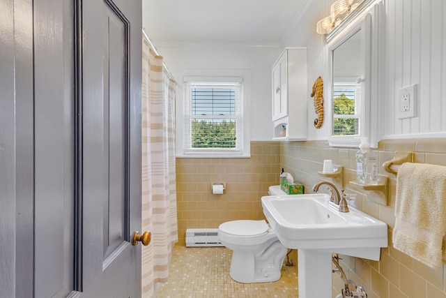 131 Henry Creek Ln, Kilmarnock, VA 22482 - bathroom featuring baseboard heating, tile walls, toilet, healthy amount of natural light, and tile patterned flooring