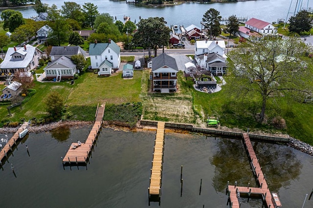 birds eye view of property with a residential view and a water view