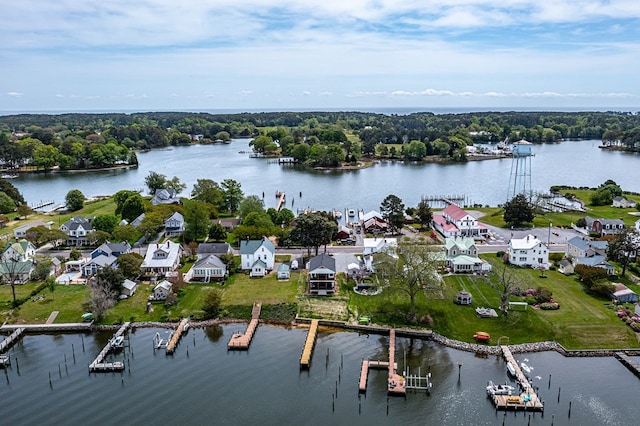 birds eye view of property with a water view and a residential view