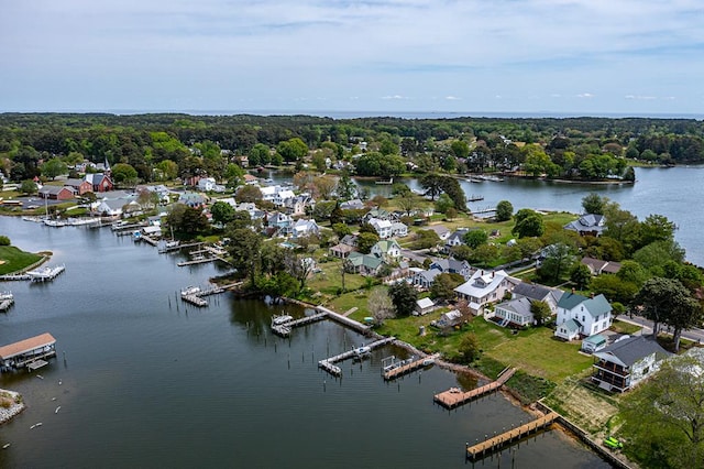 drone / aerial view with a water view and a residential view