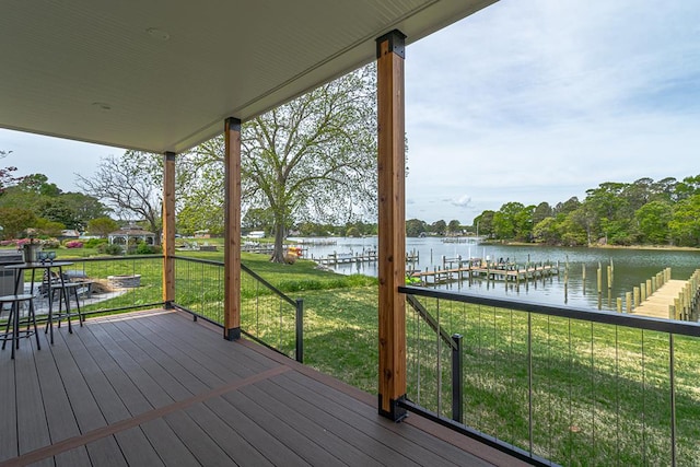 wooden deck featuring a yard and a water view
