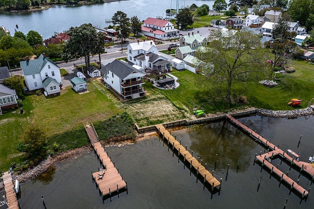 bird's eye view featuring a water view and a residential view