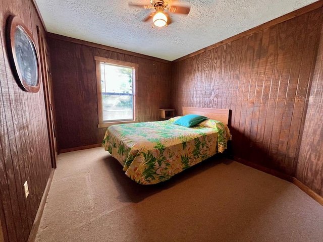 59 Judith Sound Cir, Lottsburg, VA 22511 - bedroom with wood walls, light carpet, a textured ceiling, and a ceiling fan