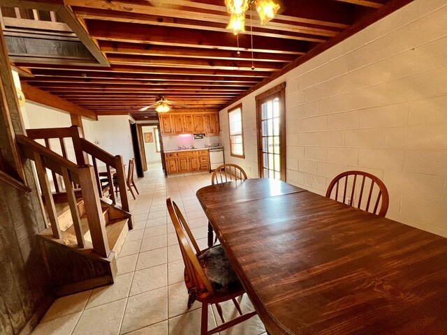 59 Judith Sound Cir, Lottsburg, VA 22511 - dining area featuring light tile patterned flooring, stairway, a ceiling fan, and concrete block wall