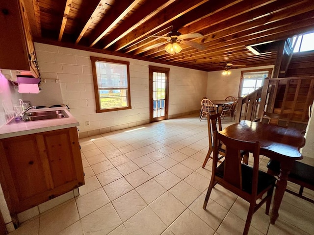 59 Judith Sound Cir, Lottsburg, VA 22511 - dining area with a ceiling fan, light tile patterned floors, healthy amount of natural light, and concrete block wall